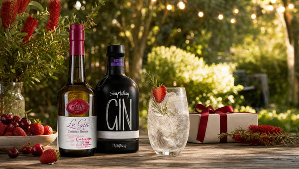 Christian Drouin Le Gin Carmina and Hartshorn Sheep Whey Gin with a strawberry gin and tonic on a garden table in summer