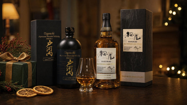Togouchi 15 Year Japanese whisky and Sakurao Sauternes Cask Finish single malt with their gift boxes and a glass of whisky